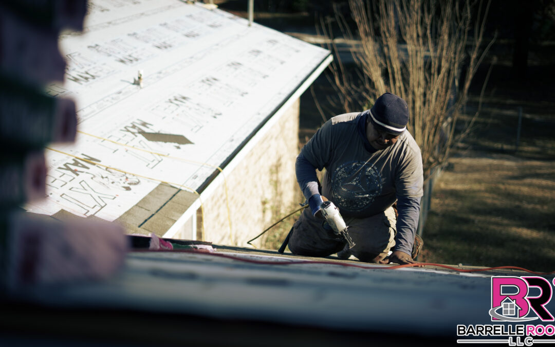 A professional roofer installs new shingles