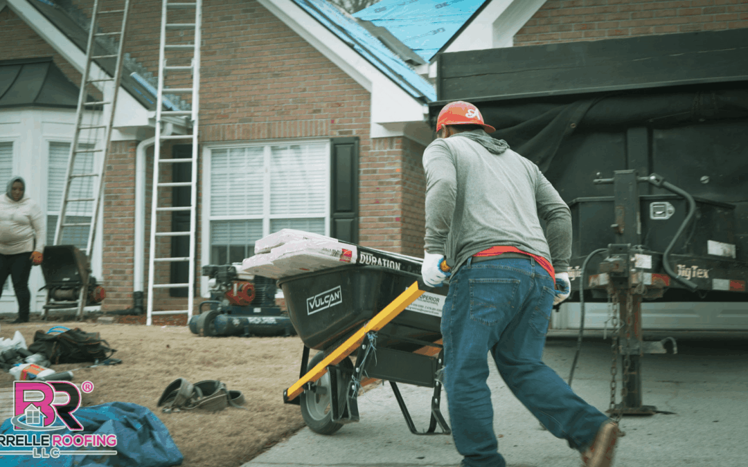 Roofer pushing wheelbarrow at roofing worksite